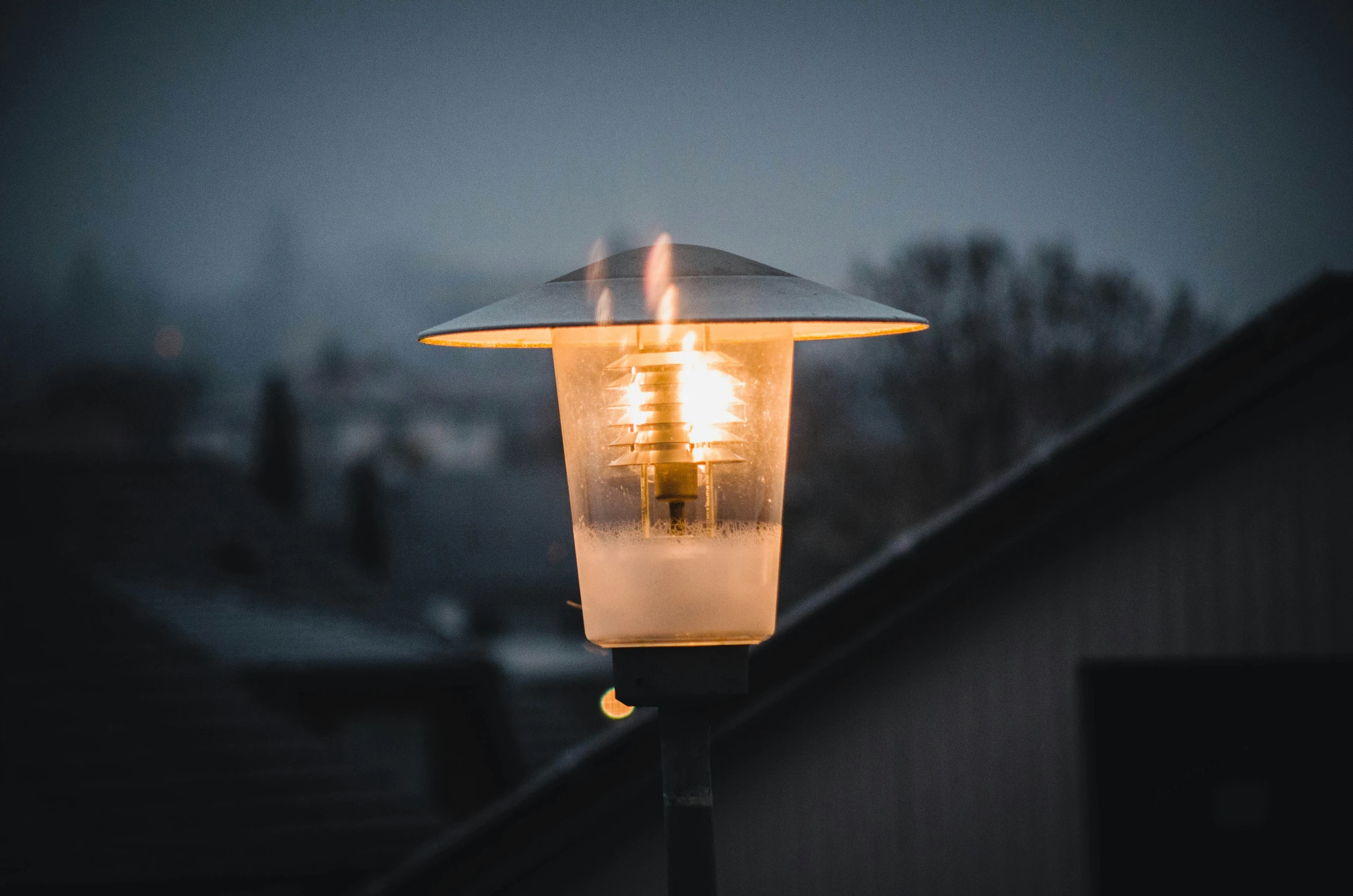 a street light is lit on a building