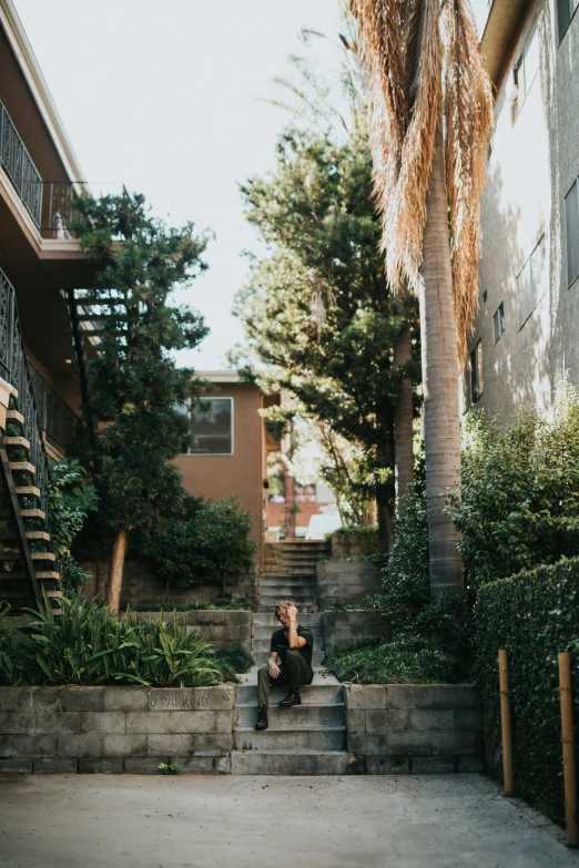 a person that is sitting on some steps