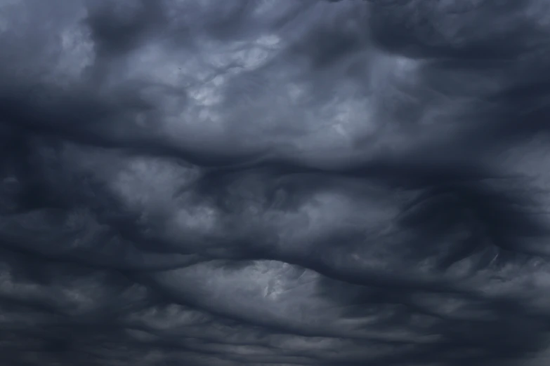 a cloud filled with very dark grey clouds