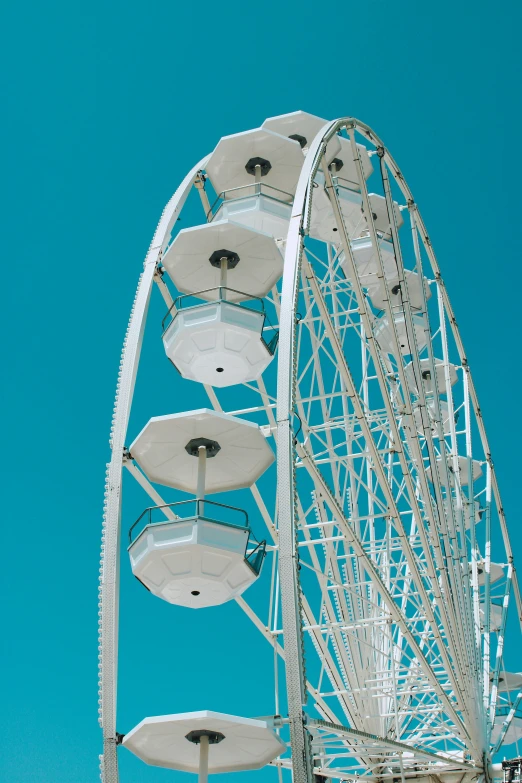 a ferris wheel that is sitting on some grass