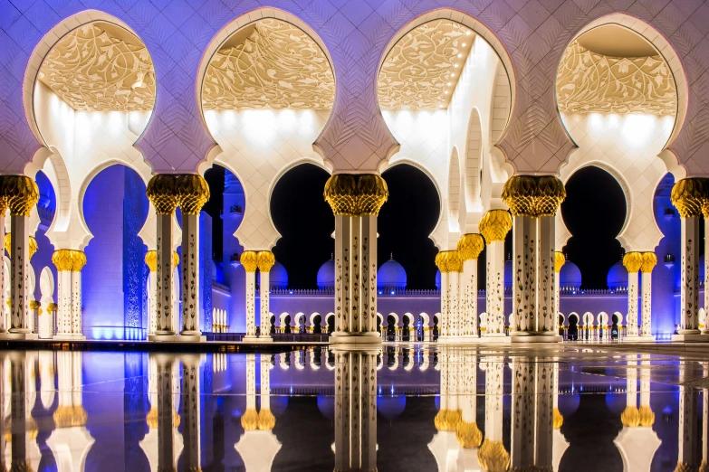 a view of a row of fancy arches and pillars with golden decorations