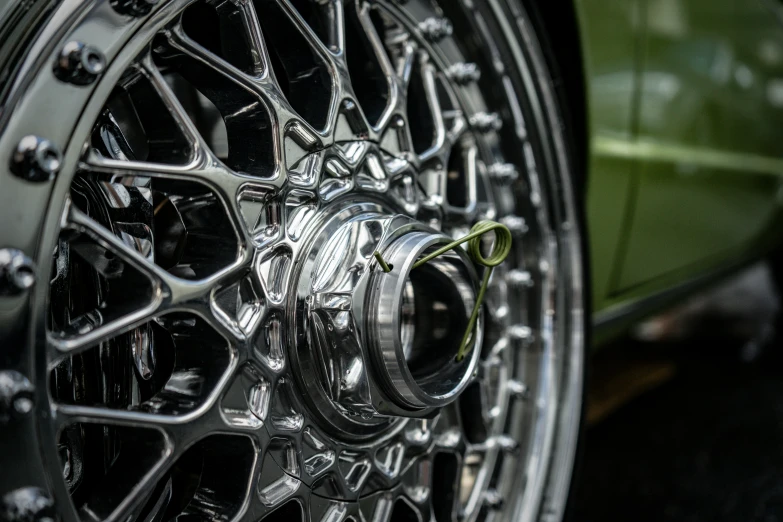 a car wheel with black and chrome paint