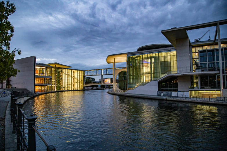 a river runs past some modern buildings