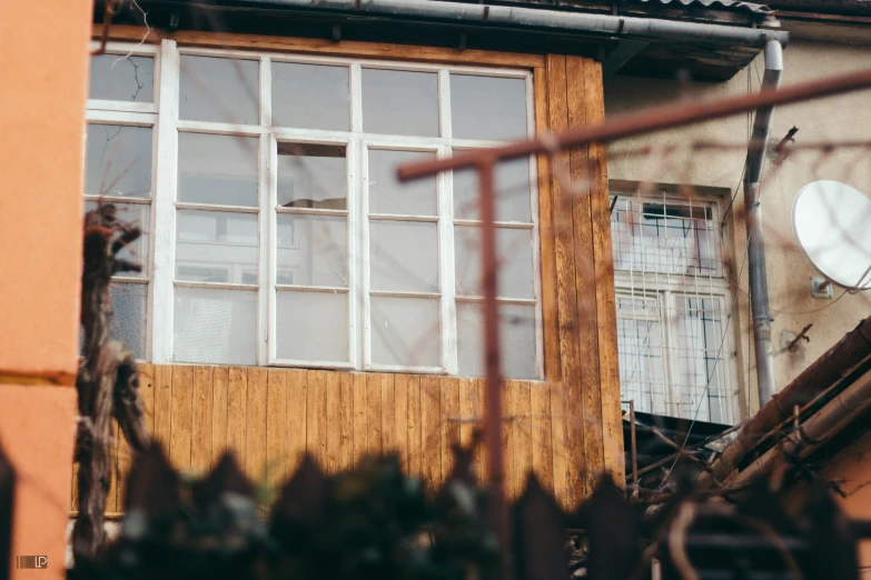 the reflection of a building is in the window