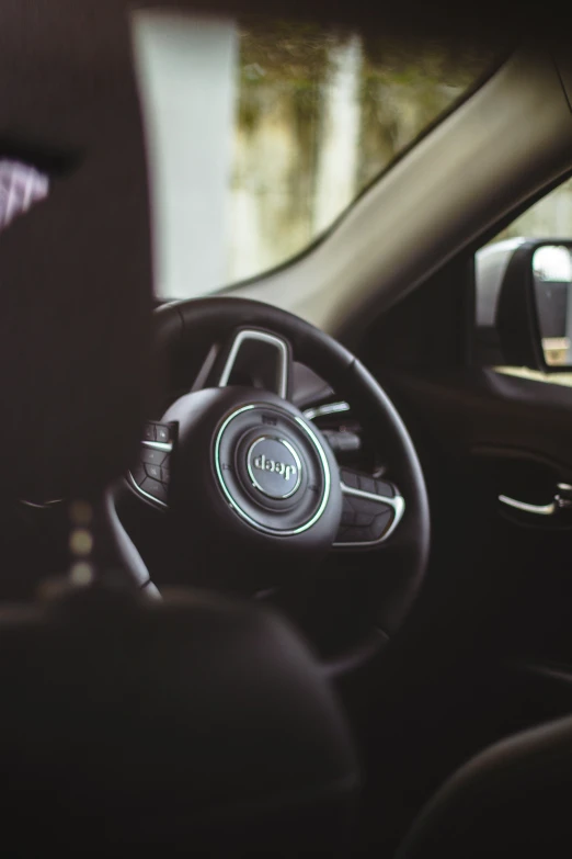 the inside of a car dashboard showing the interior and the steering wheel