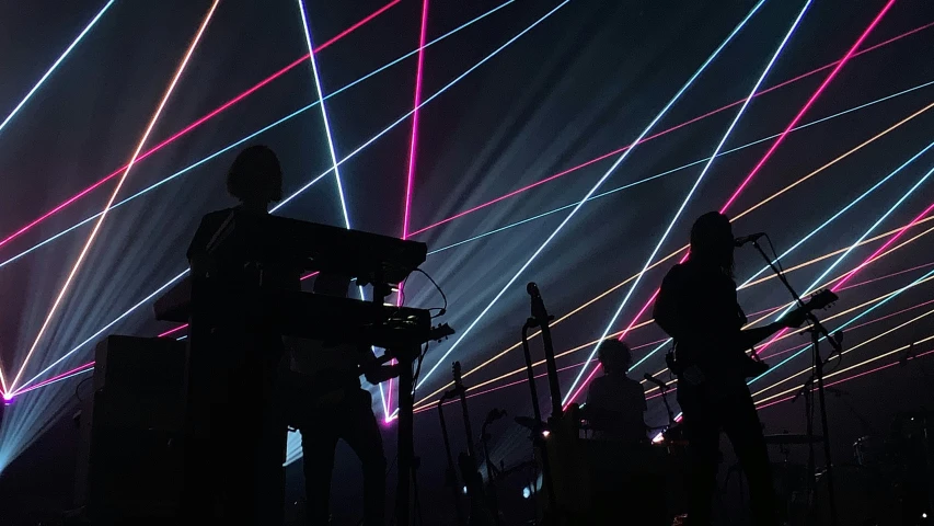 an image of people at a concert with many lights