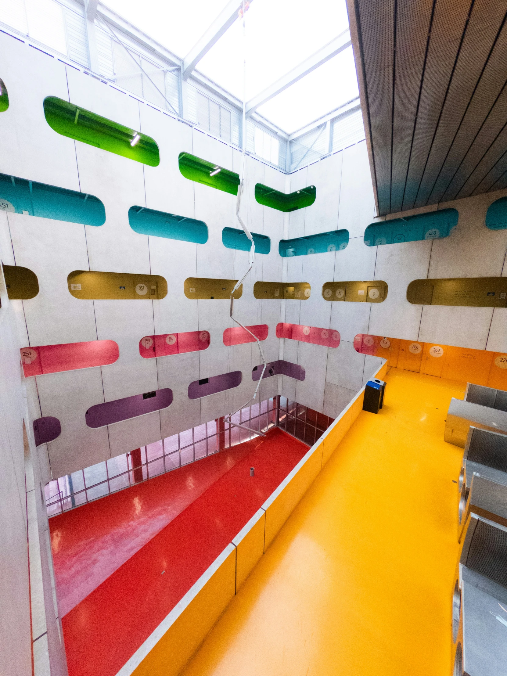 colorful room with many windows and various chairs