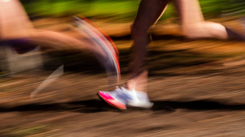 this image has a blurry image of a person's feet on a skateboard