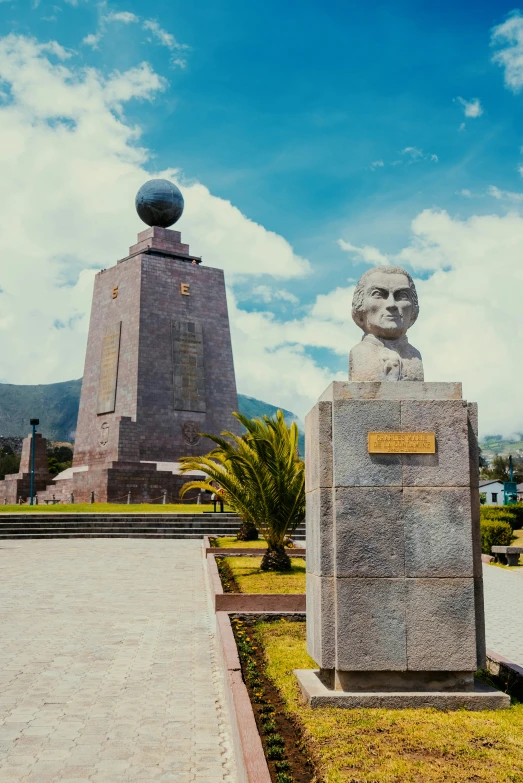 an outdoor monument with a man on it