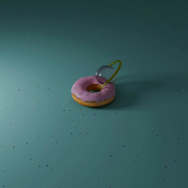 a pink doughnut sitting on top of a blue counter