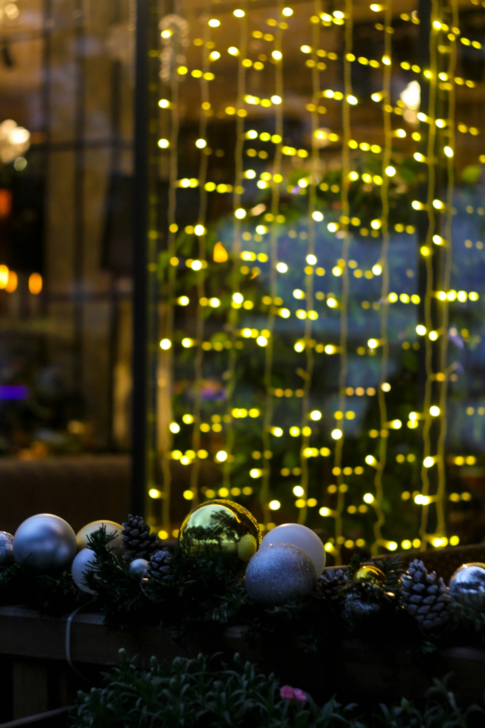 christmas decorations are set up in a window sill