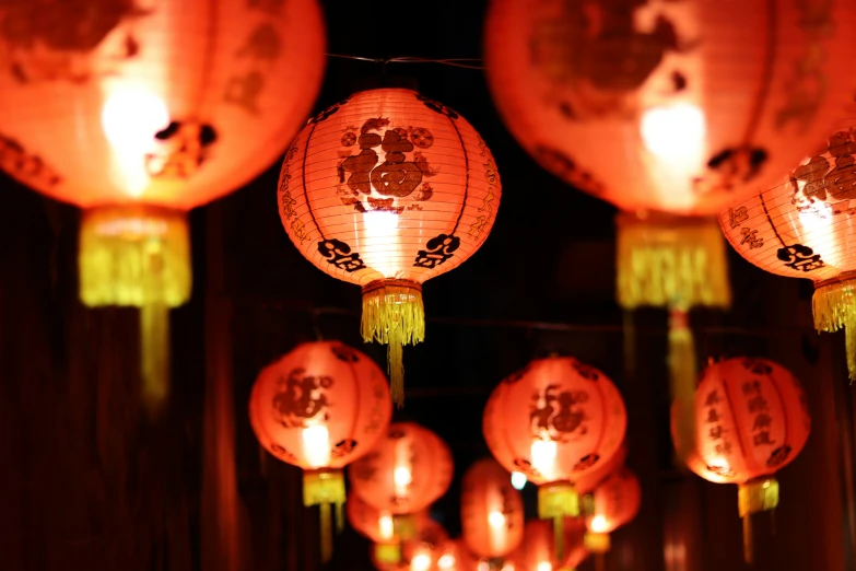 a bunch of lanterns that have been lit up