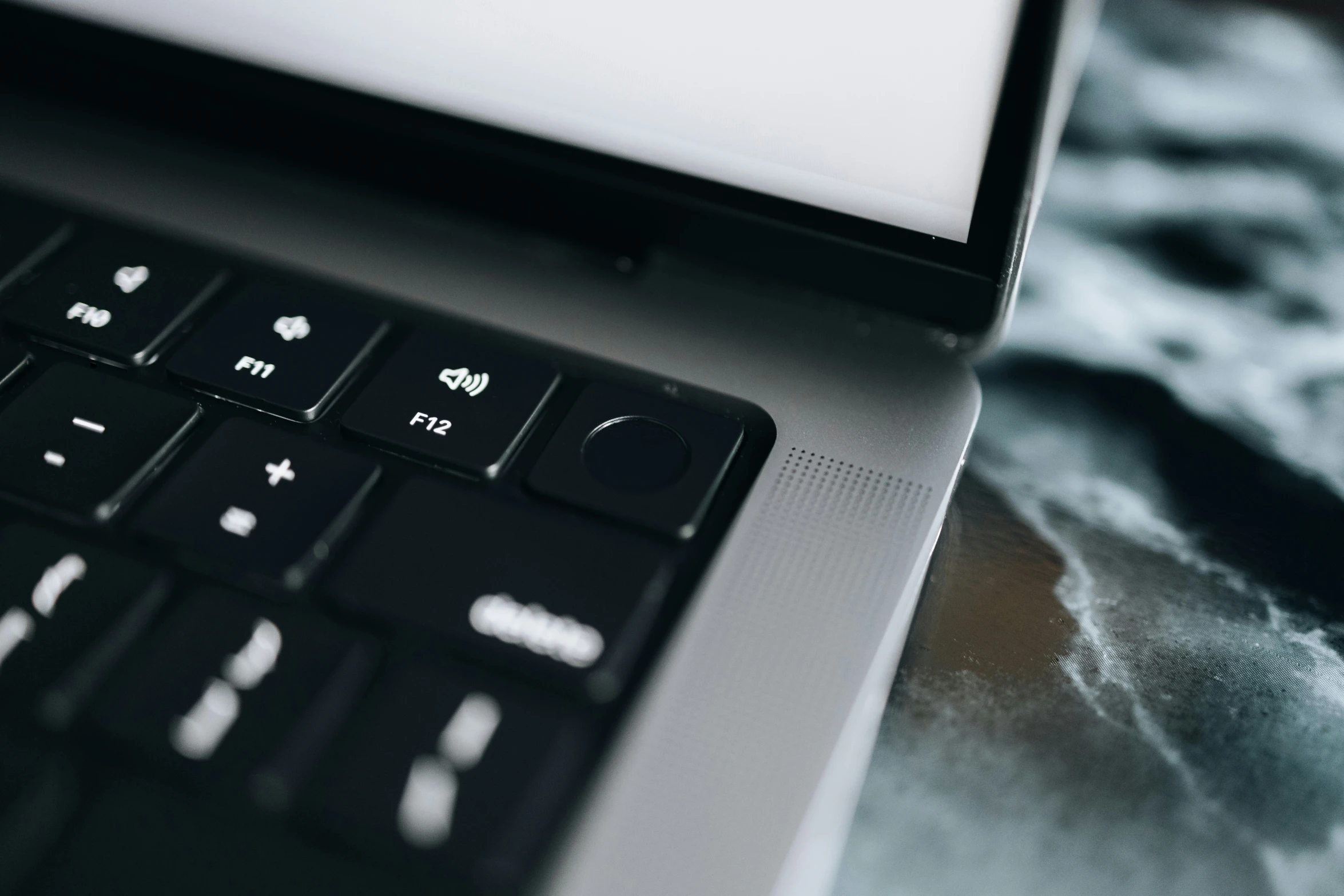 an open laptop computer sitting on top of a table