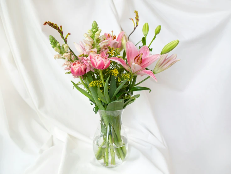 the vase is filled with the fresh flowers