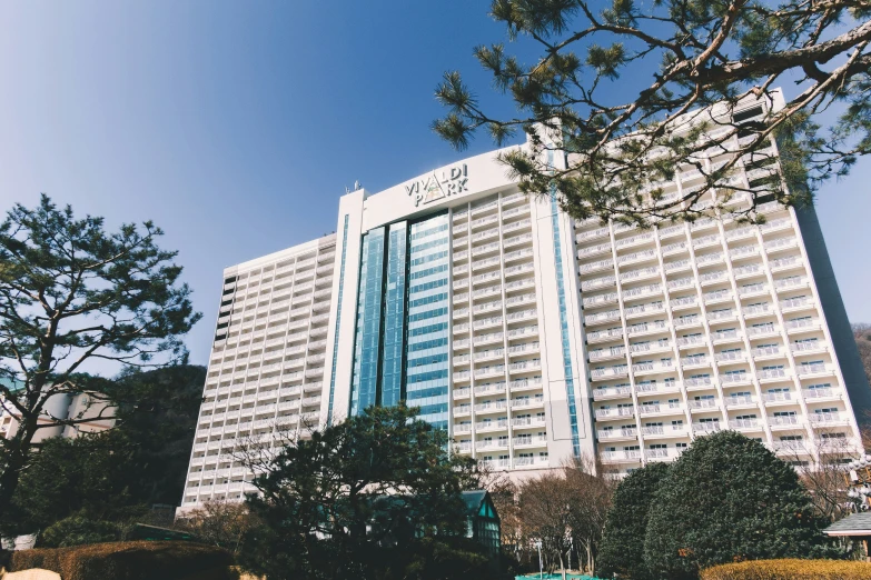 a large white building with a sky background