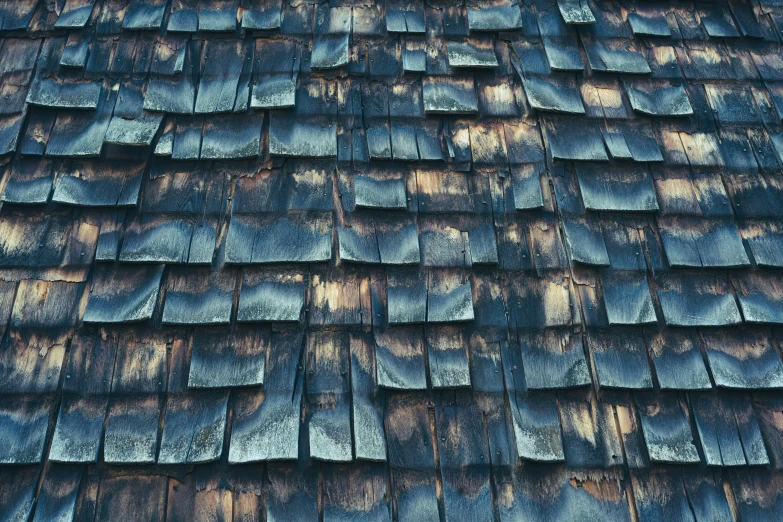 the wood on the roof is stained with dark blue paint
