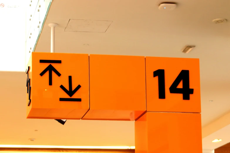 an orange sign pointing to the left