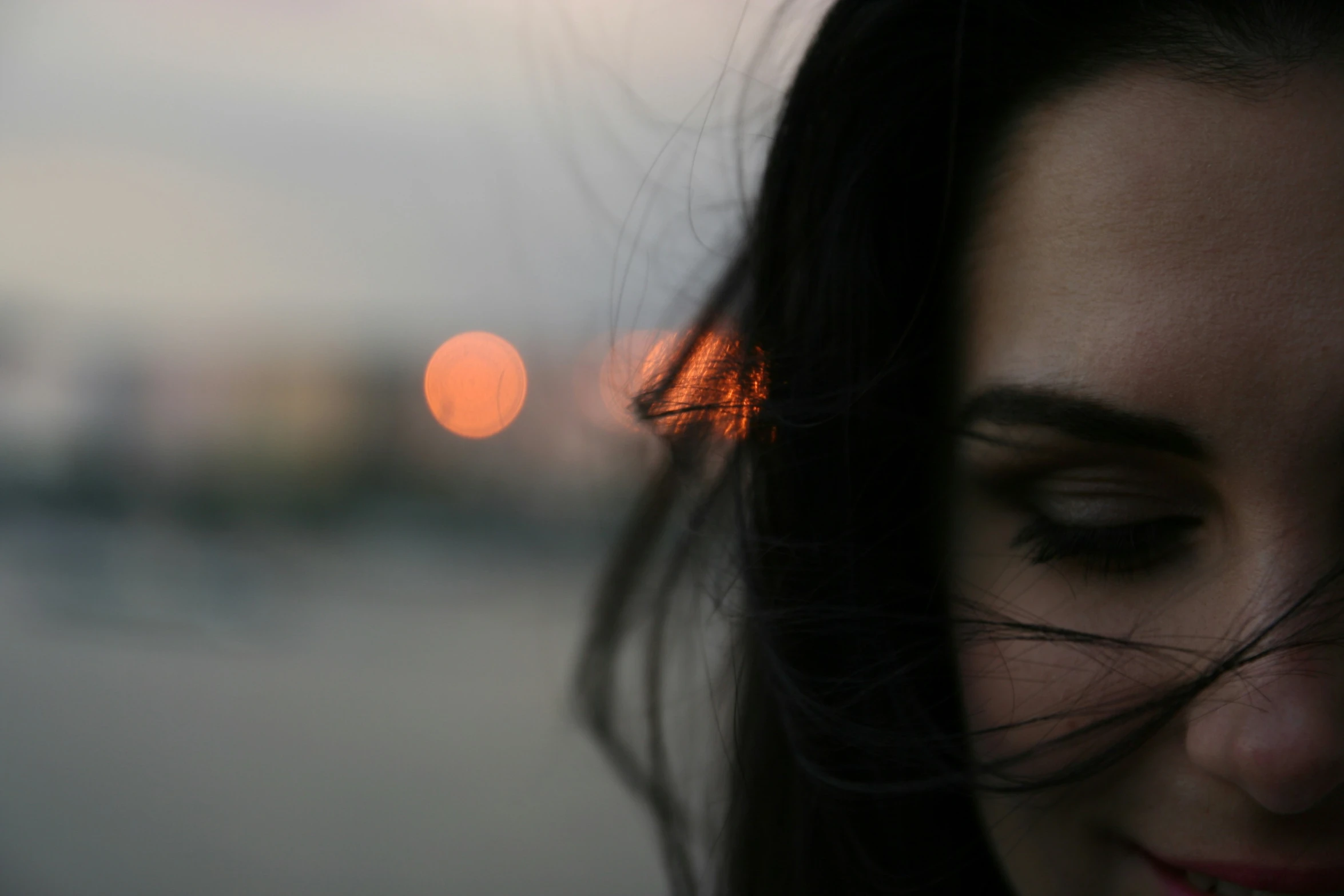 a close up of a woman's face and hair