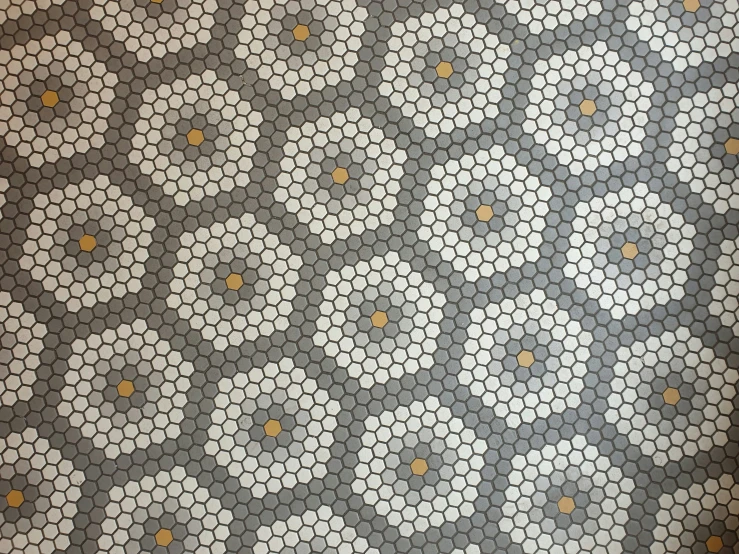 tiled floor in an office building with honeycomb patterns