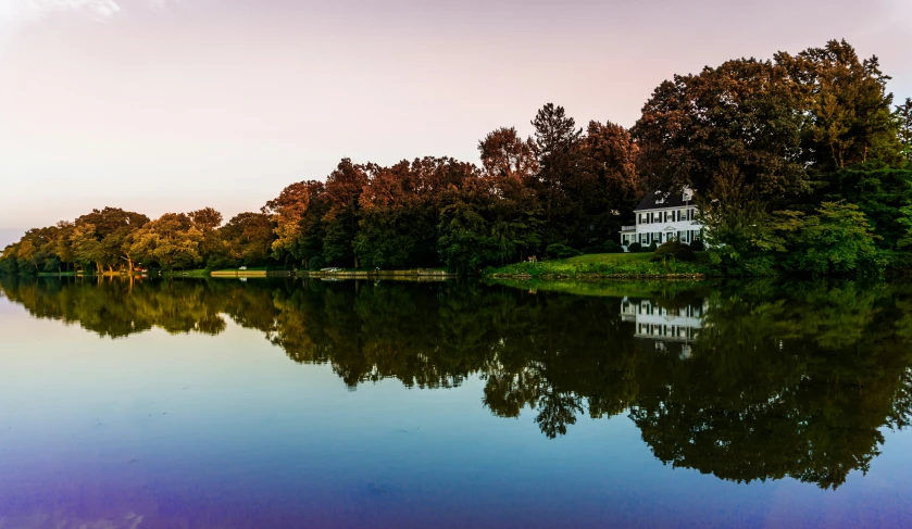 a calm lake is reflected in the water