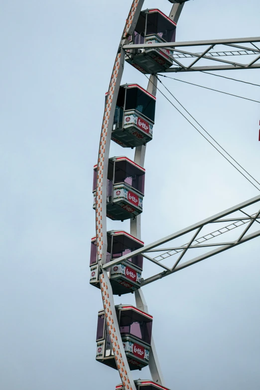 a ferris wheel with lots of seats on the side of it