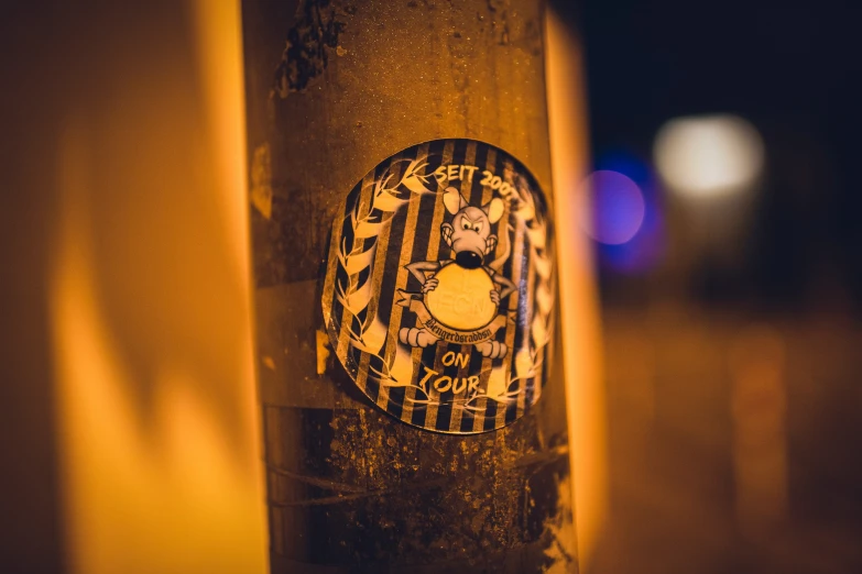 a street light with a sticker on it