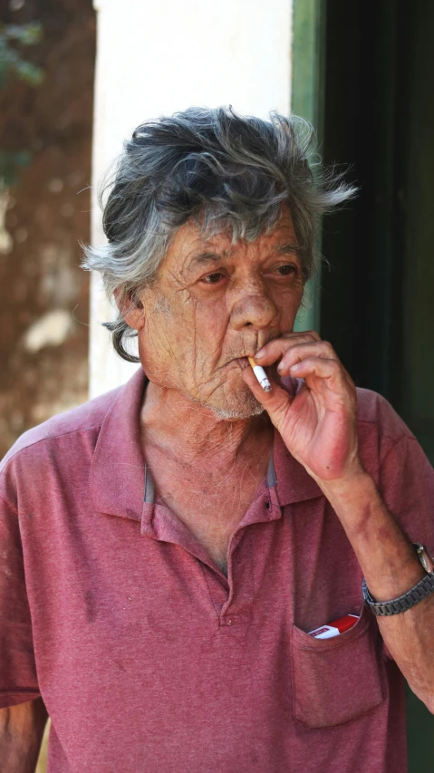 an old woman smoking in a corner