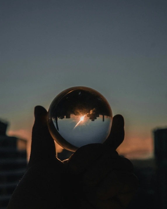 a person holding up an empty ball in the air