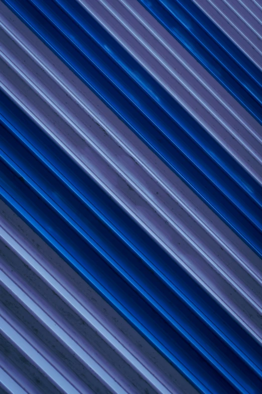 abstract image of diagonal, stripes on the blue wall