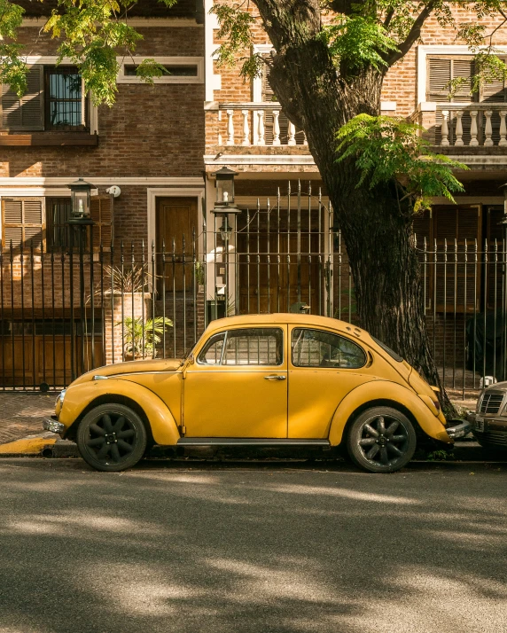 a beetle car is shown sitting in the street