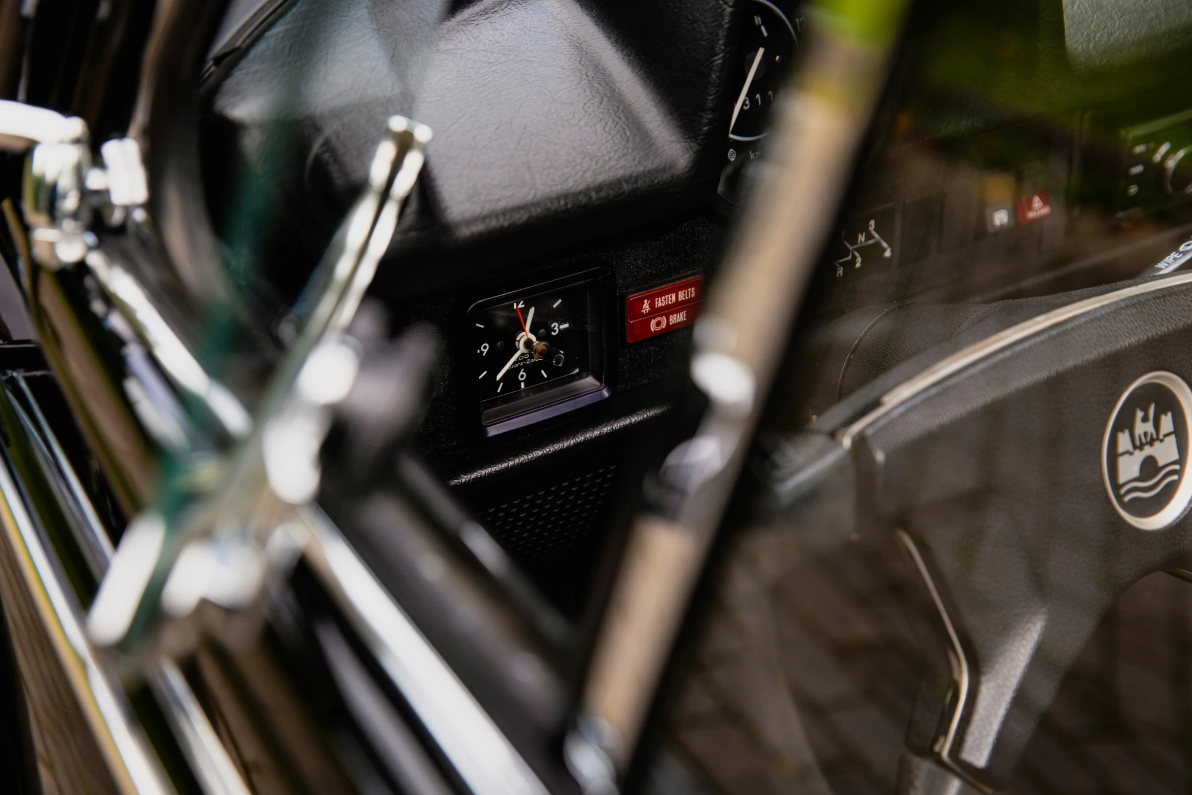 the dashboard of a motorcycle with two black numbers