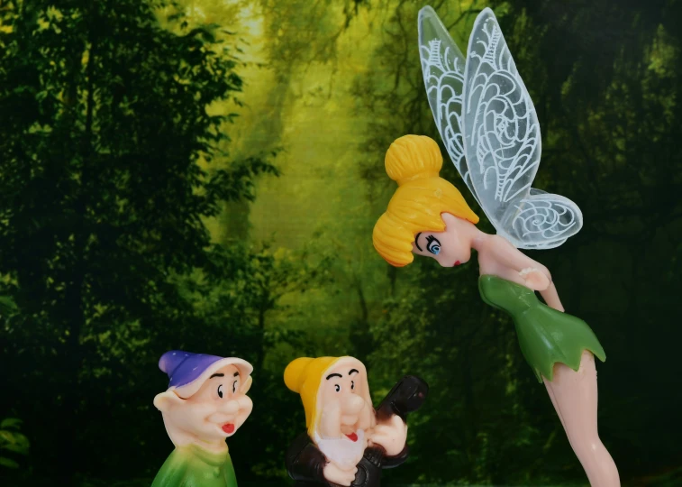 tinkerbells are dancing in front of a painting