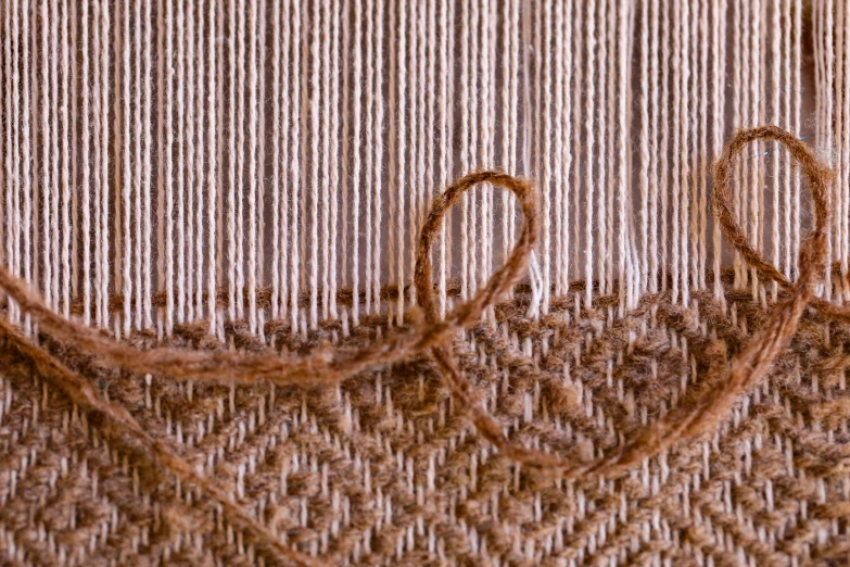 two round stitchs with yarn in the background