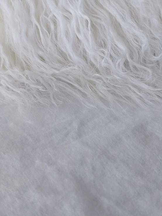 a white sheepskin is covering up by some light