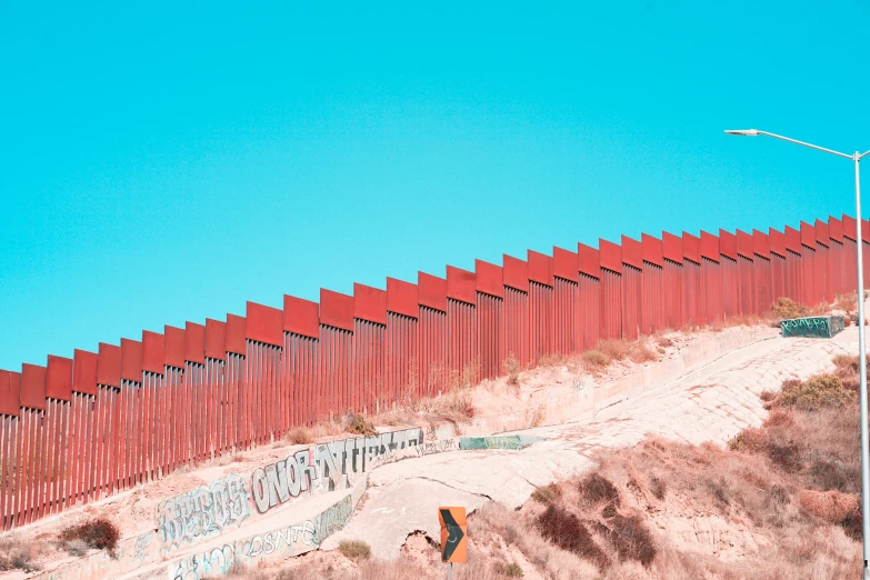the border fence separating several locations around the city