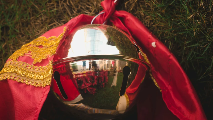 a helmet in a red ribbon with an umbrella