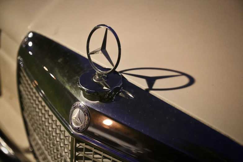 the hood ornament on a mercedes vehicle