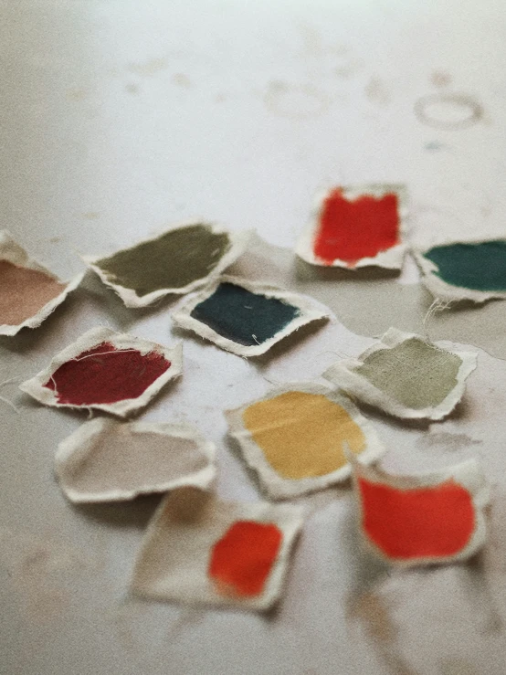 a group of different colored pieces of paper