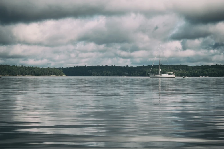 a boat in a body of water near land