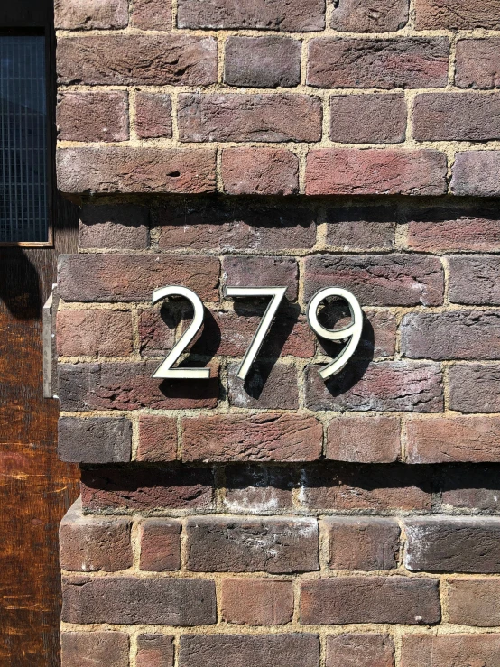 brick building number with numbers on the side