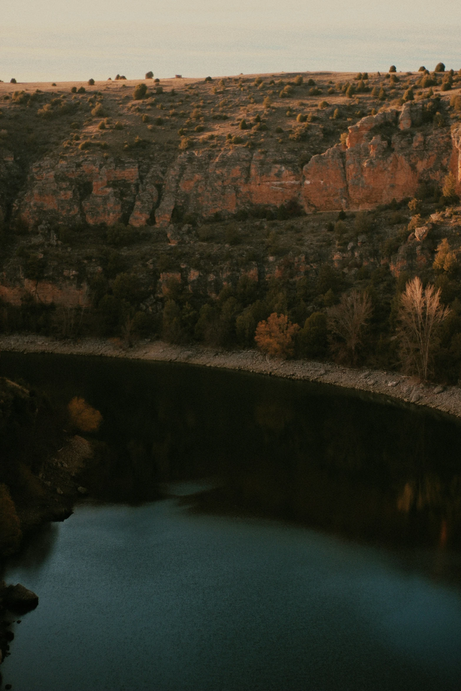 a train on the tracks by some water