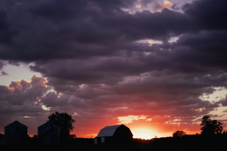 clouds are shown in the distance above a rural scene