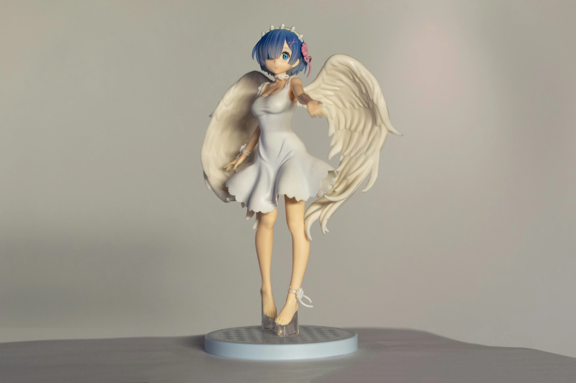 a figurine that is wearing an angel dress