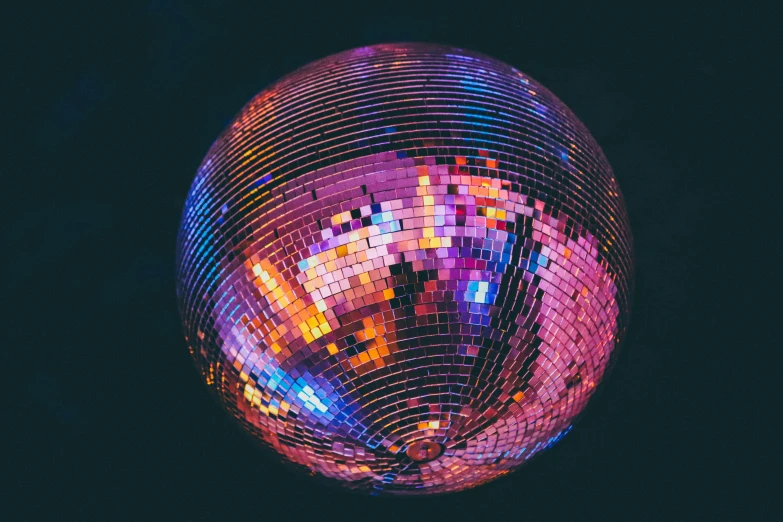 disco ball illuminated with brightly colored lights