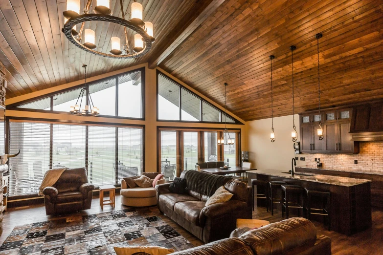 a very big beautiful room with wood ceiling