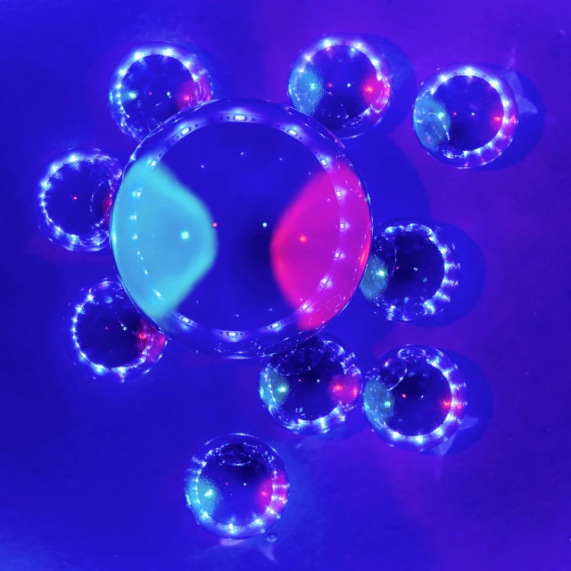 an array of illuminated objects against a blue background