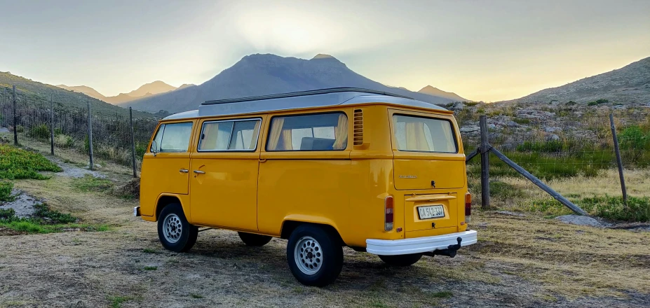 a small camper van sits in the desert