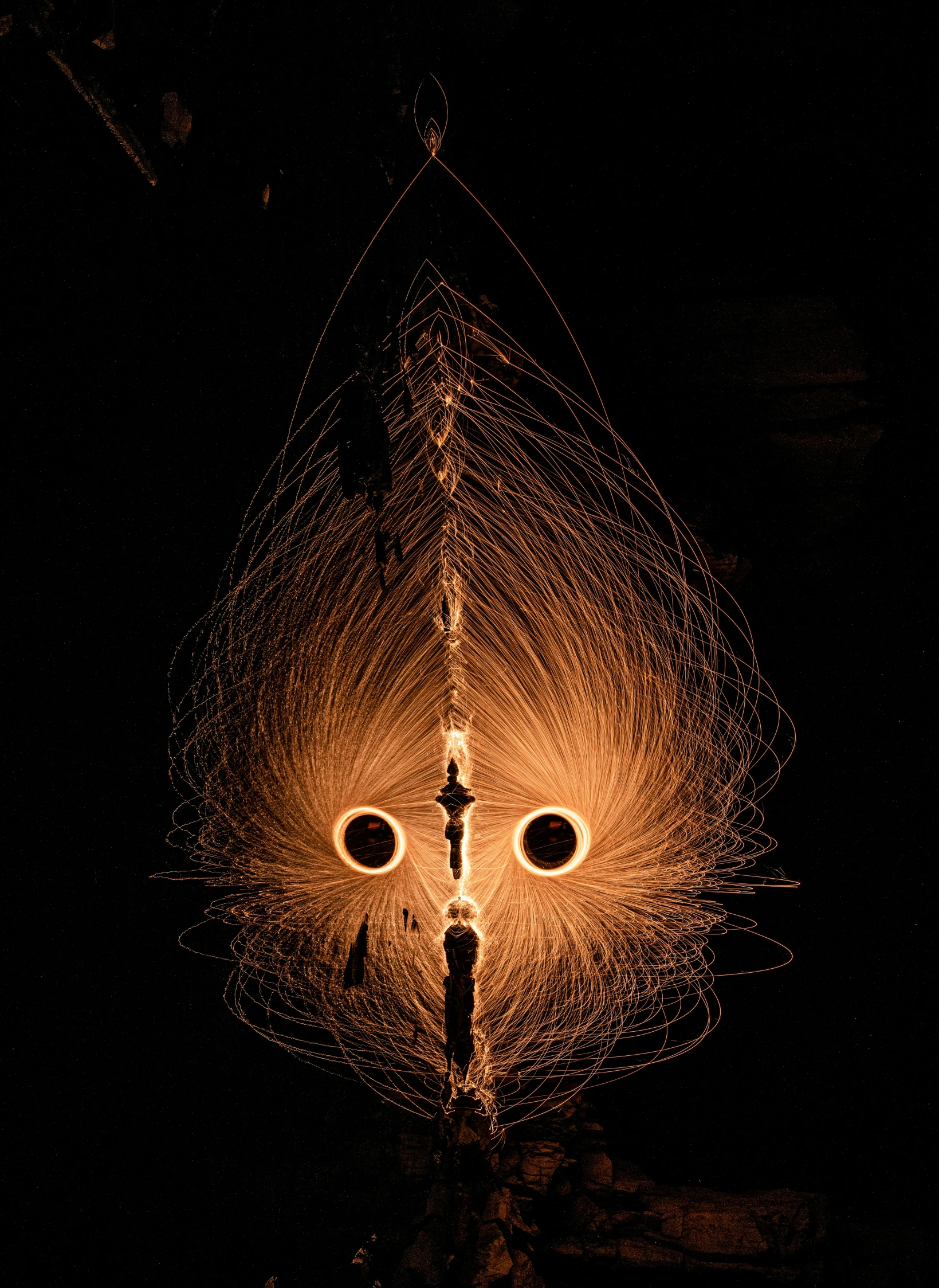 the front view of a street lamp on a dark street