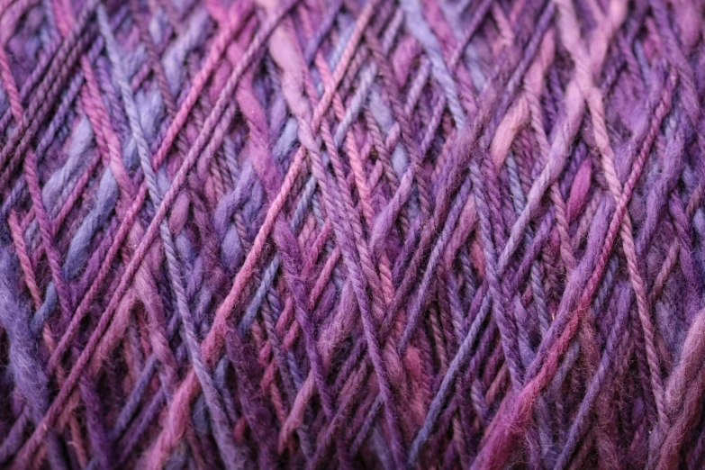 wool and alpaca are mixed together in shades of purple