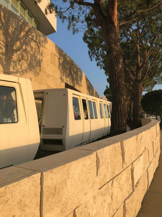 a couple of buses parked on the side of a road